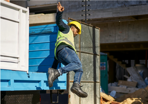 worker jumping out the back of a truck, workplace injury, workplace safety, construction site, construction injury, work injury
